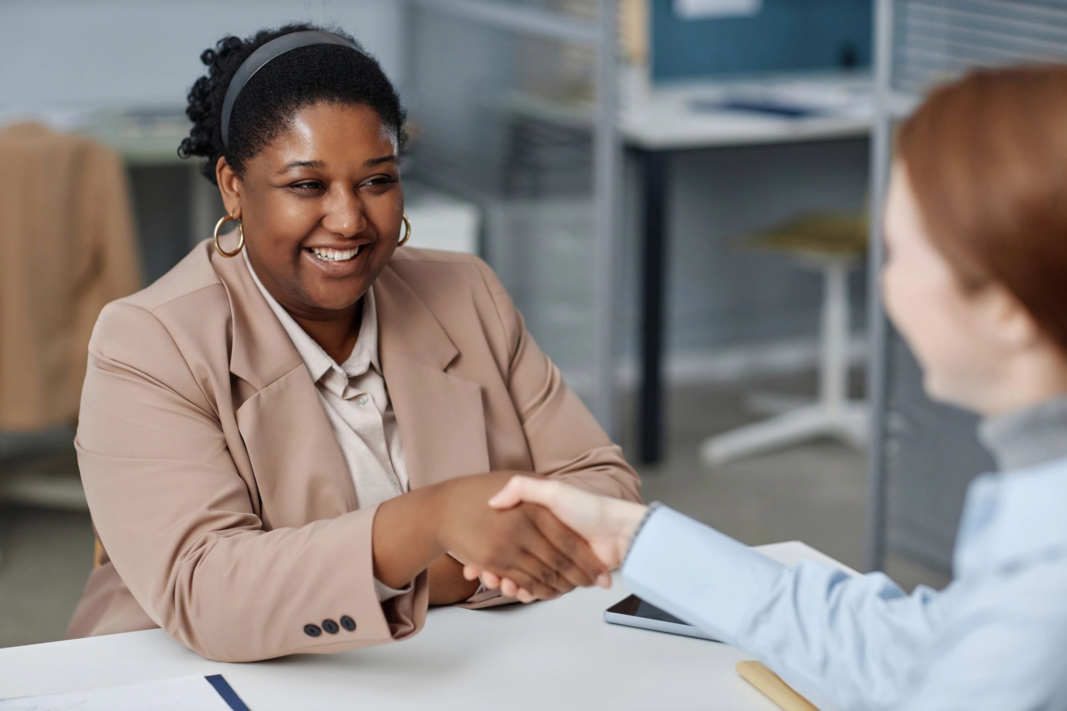 Recruiter greeting a candidate during an interview